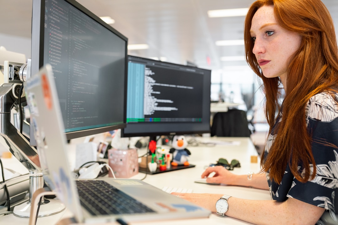 A woman in an office researching computer telephony integration on her computer